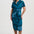 Woman wearing a blue patterned dress on a white background