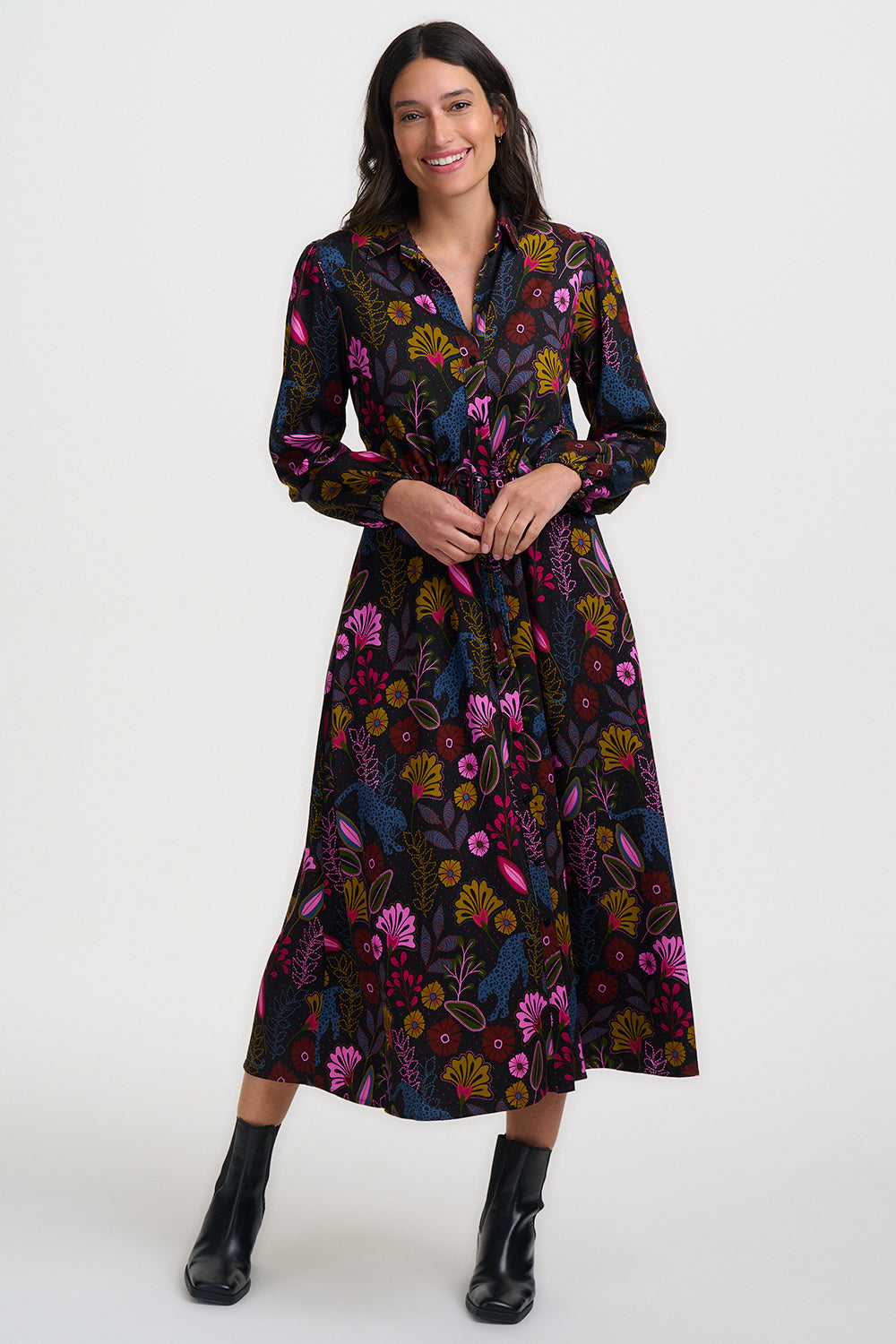 Woman wearing a floral dress on a white background