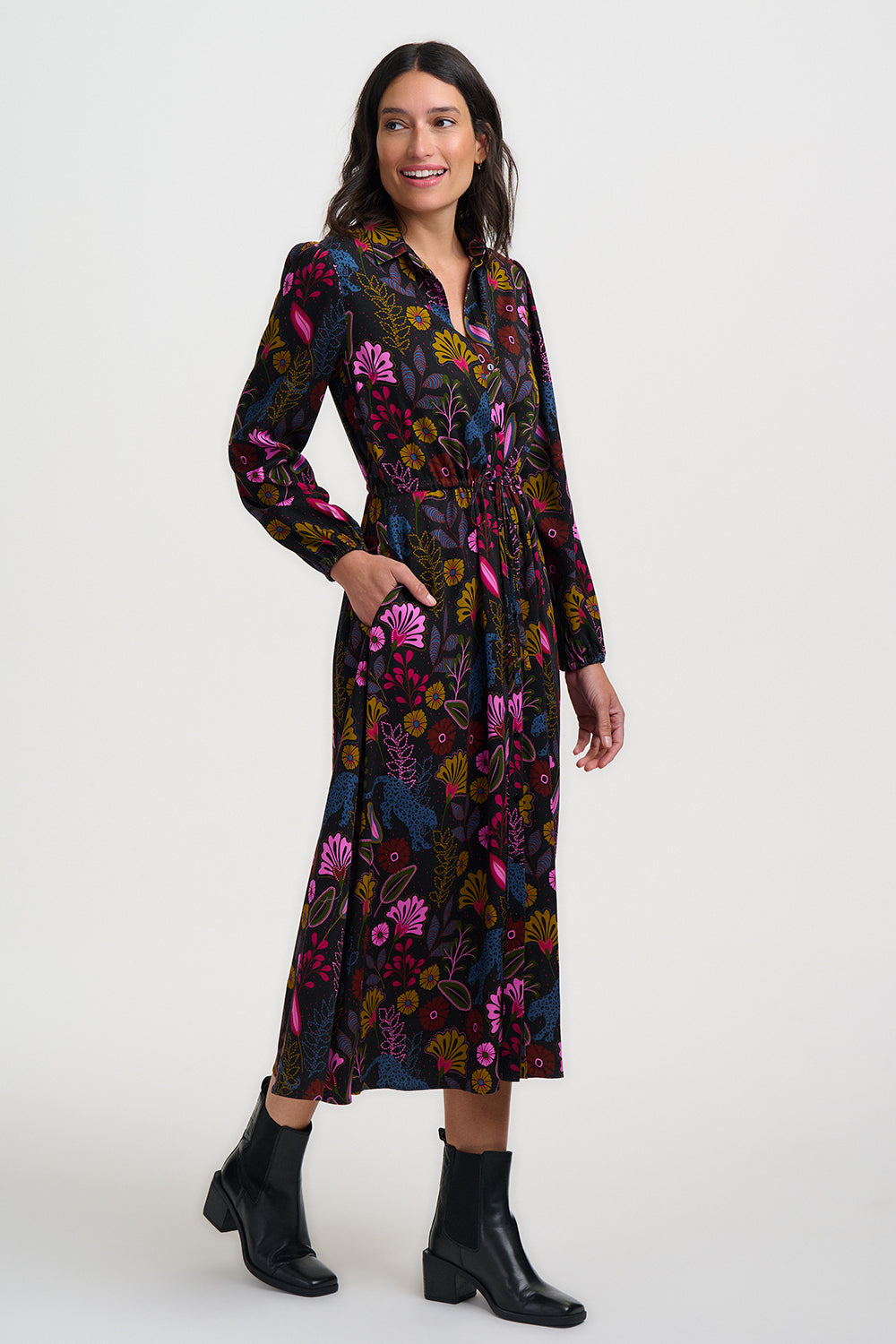 Woman wearing a floral dress with a white background