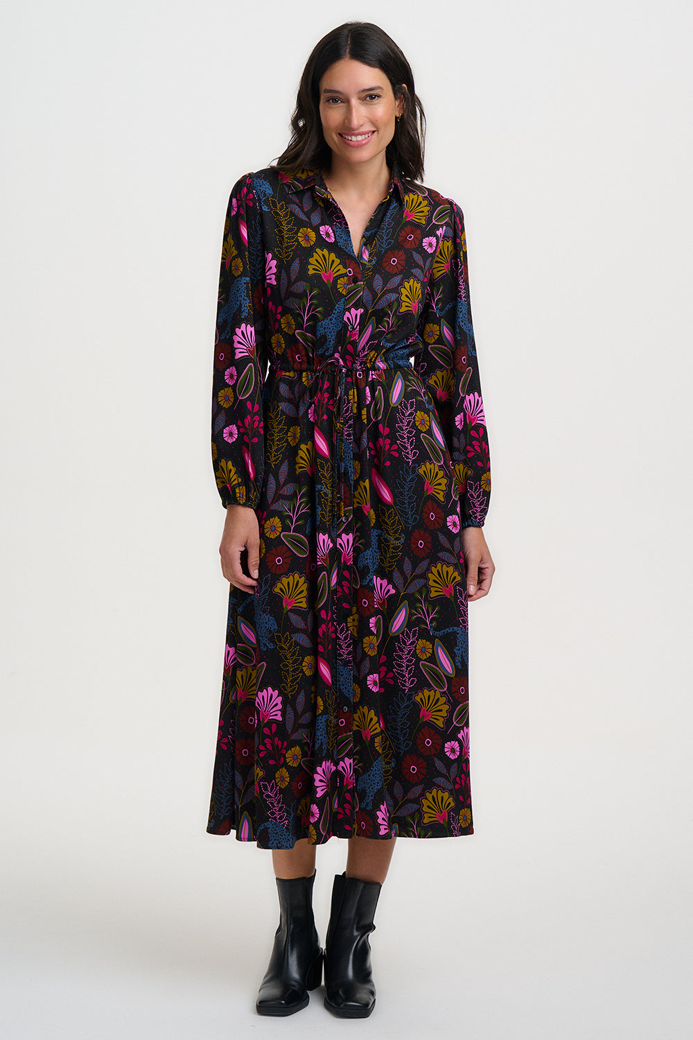 Woman wearing a floral dress on a white background