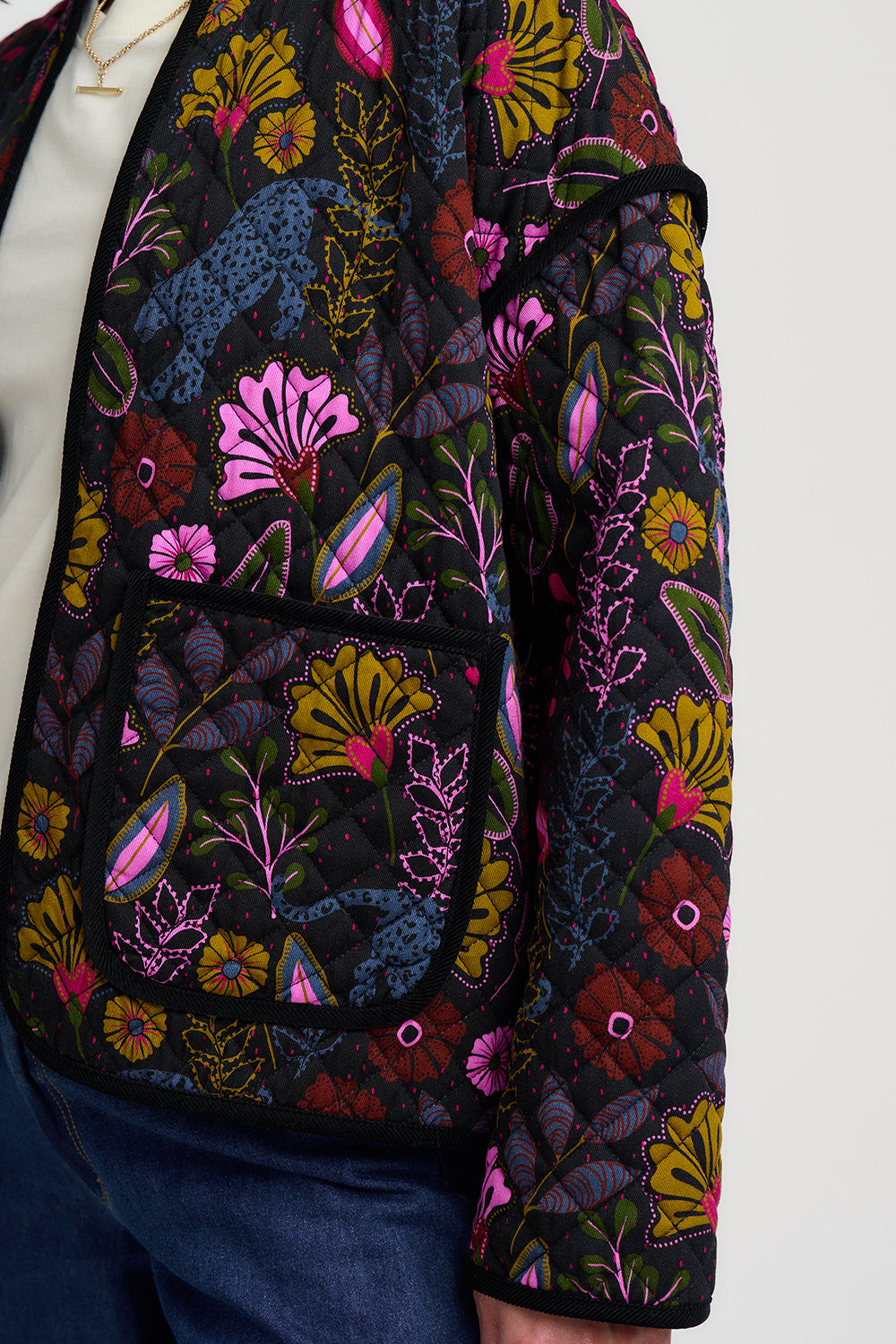 Floral patterned jacket with colorful flowers on a white background