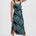 Woman wearing a blue patterned dress on a white background