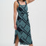Woman wearing a blue patterned dress on a white background