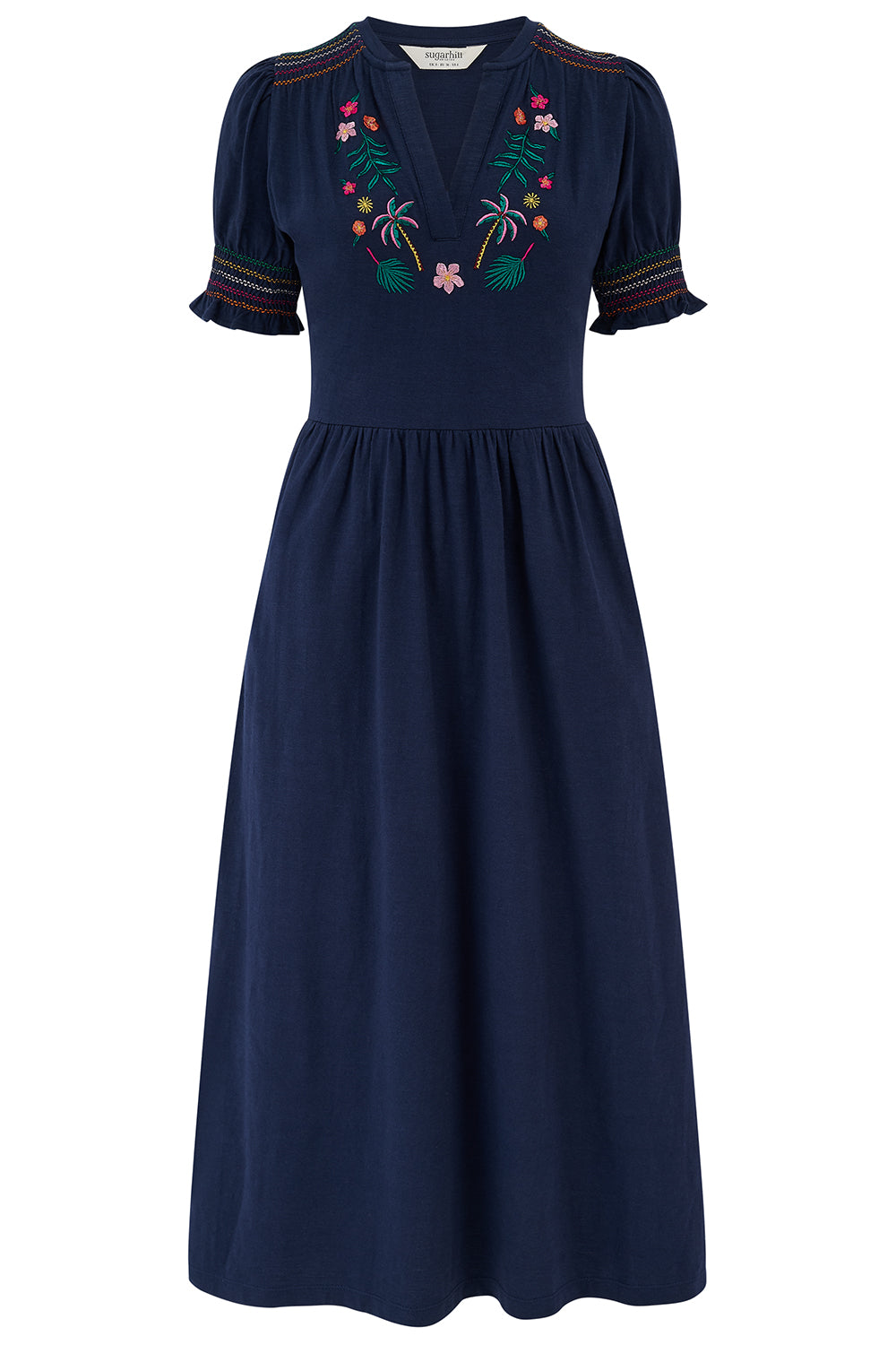 Woman wearing a navy dress with puff sleeves on a white background