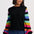 Black jumper with colorful striped sleeves on a white background