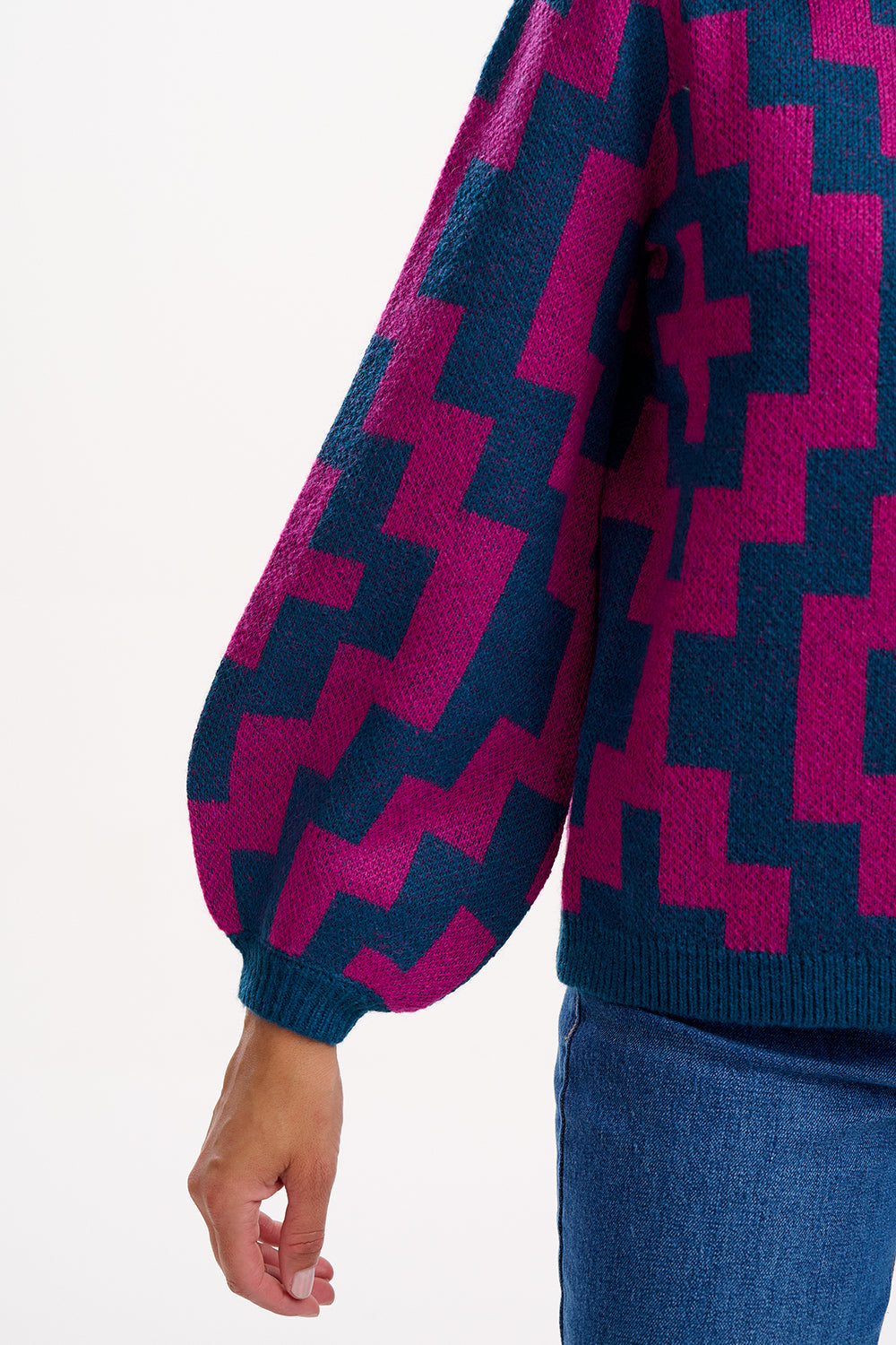 Close-up of a sweater with a geometric pattern on a white background