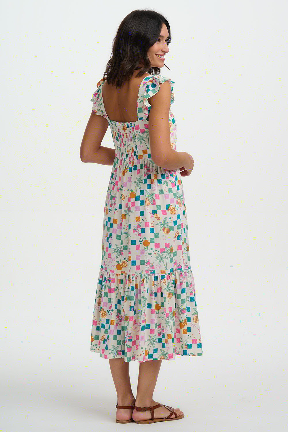 Woman wearing a floral dress on a white background