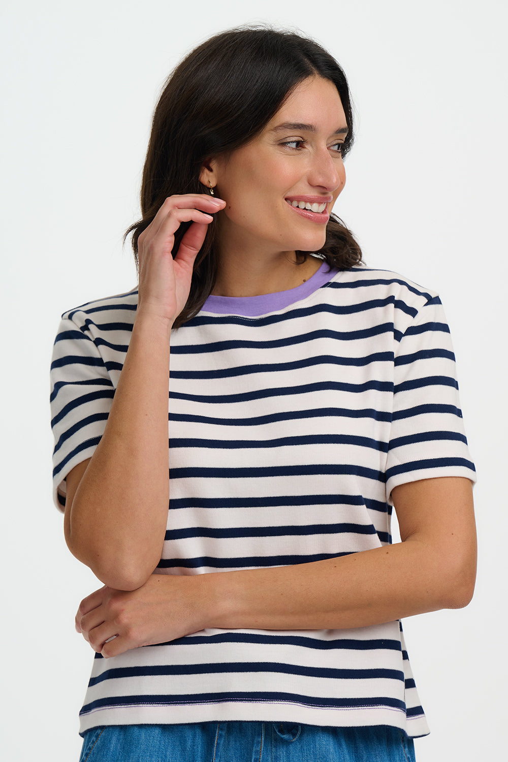 Woman wearing a striped shirt with a white background