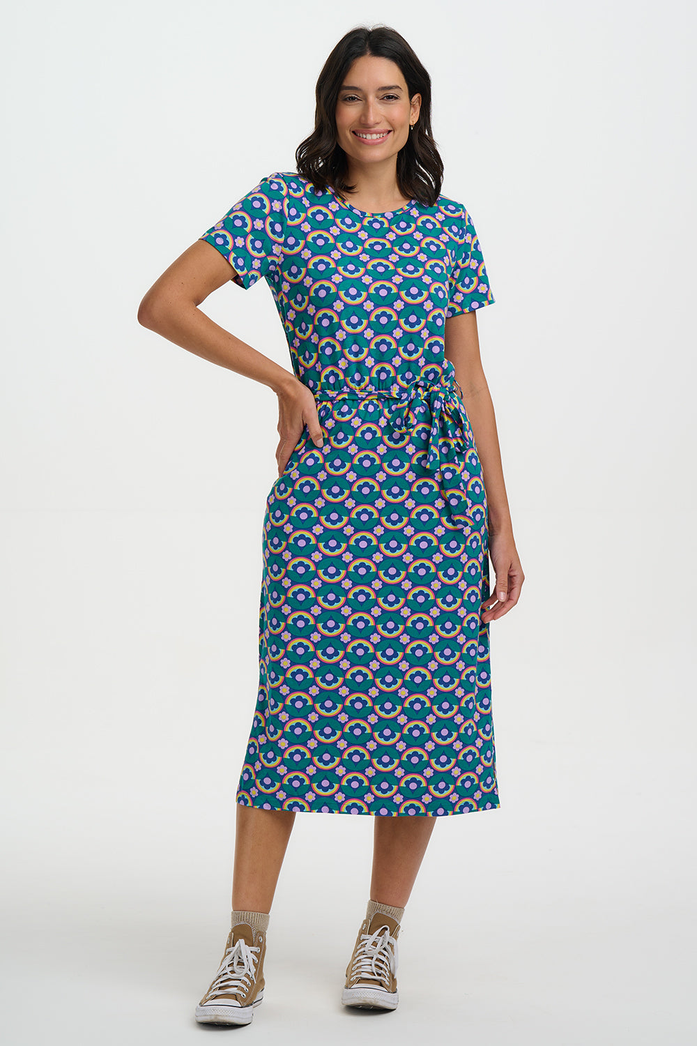 Woman wearing a blue patterned dress on a white background