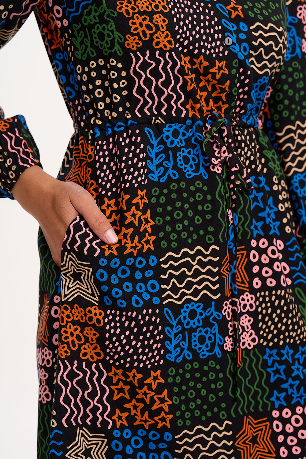 Colorful patterned apron with geometric designs on a white background