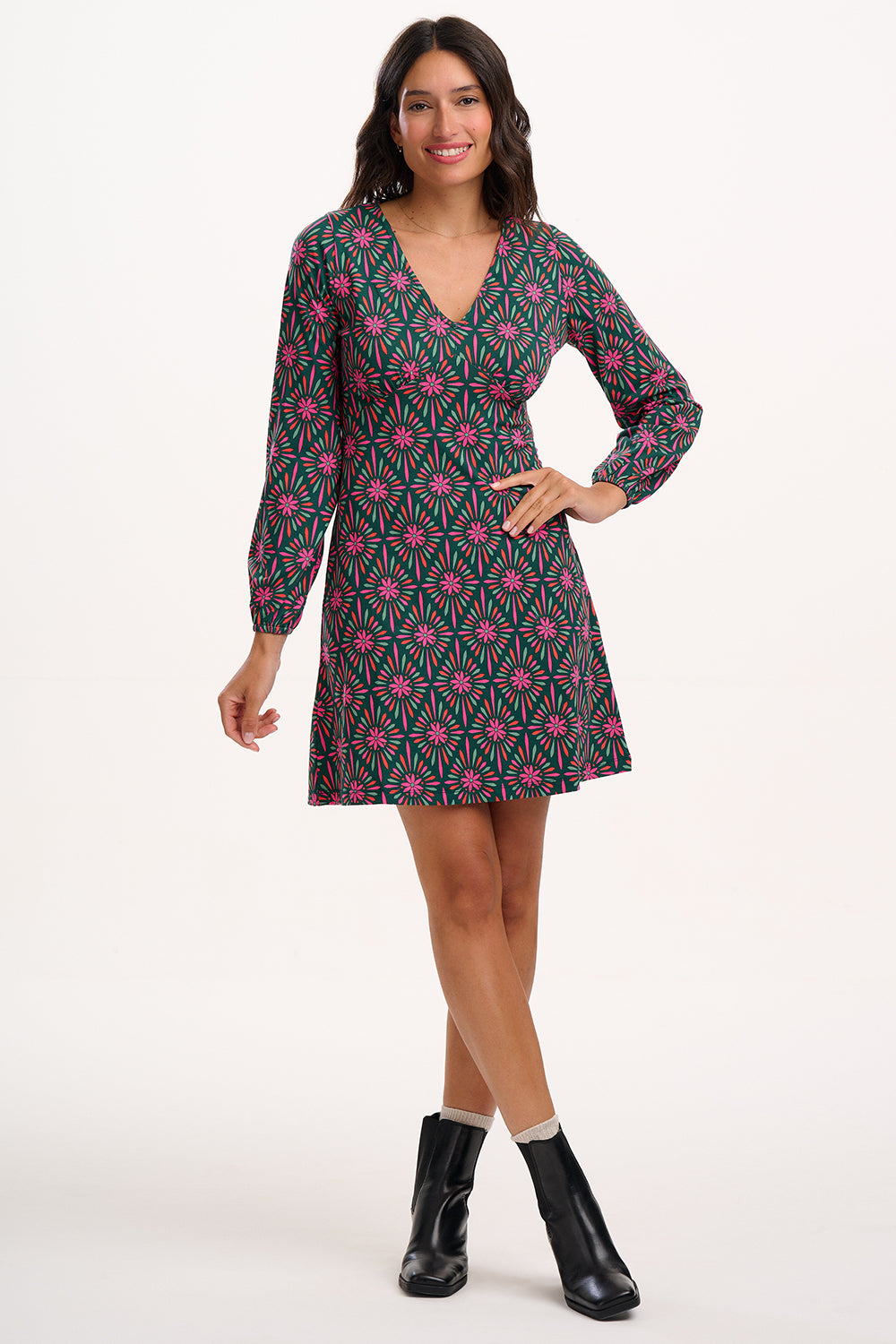 Sugarhill Brighton model wearing a patterned dress on a white background