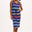 A model wearing a navy jersey midi dress with multicolor stripes, featuring a V-neck and a drawstring waist.