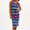 A model wearing a navy jersey midi dress with multicolor stripes, featuring a V-neck and a drawstring waist.