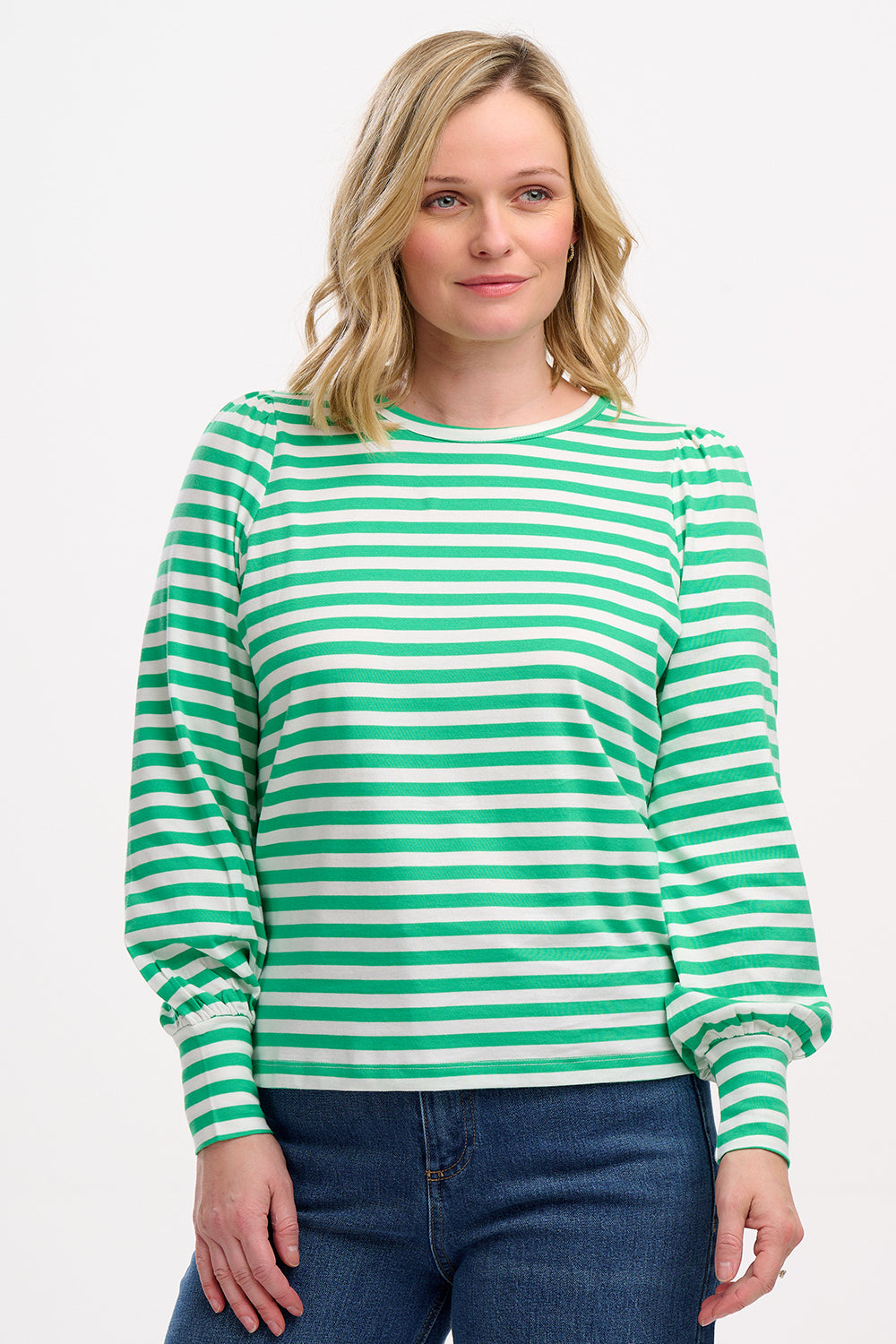 A woman wearing a green and off-white striped jersey top with a round neckline and long puff sleeves.