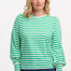 A woman wearing a green and off-white striped jersey top with a round neckline and long puff sleeves.