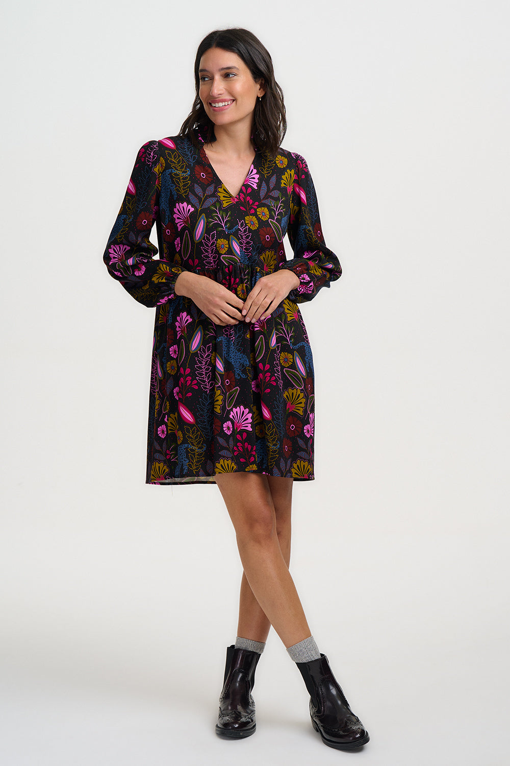 Woman wearing a floral dress on a white background