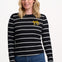 Sugarhill Brighton model wearing a black and white striped sweater with a small yellow design on a white background