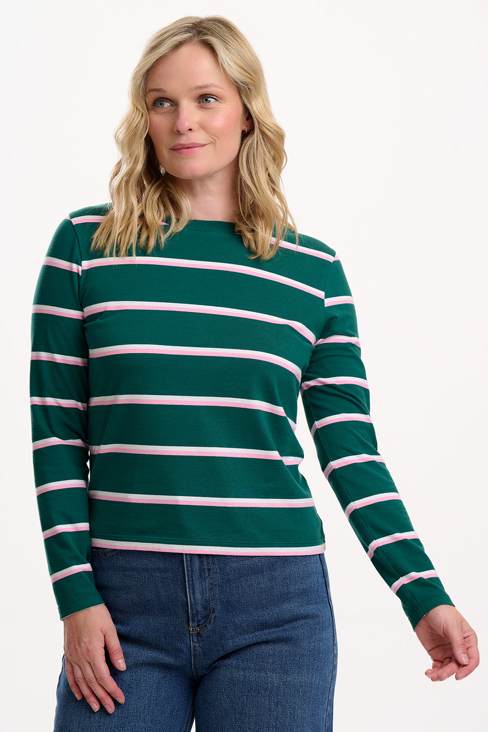 Sugarhill brighton model wearing a green and pink striped sweater on a white background