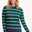 Sugarhill brighton model wearing a green and pink striped sweater on a white background