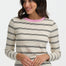 Woman wearing a striped sweater with a pink neckline on a white background