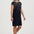 Woman wearing a black dress with a colorful pattern on a white background