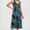 Woman wearing a green and black patterned dress on a white background