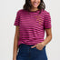 Woman wearing a pink and purple striped t-shirt with a leopard print design on a plain background