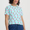 Light blue t-shirt with pink cherry pattern on a white background