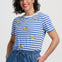 Blue and white striped t-shirt with yellow banana prints on a plain background