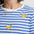 Blue and white striped t-shirt with yellow banana prints on a plain background