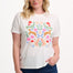 Sugarhill Brighton model  wearing a white t-shirt with floral and animal design on a plain background