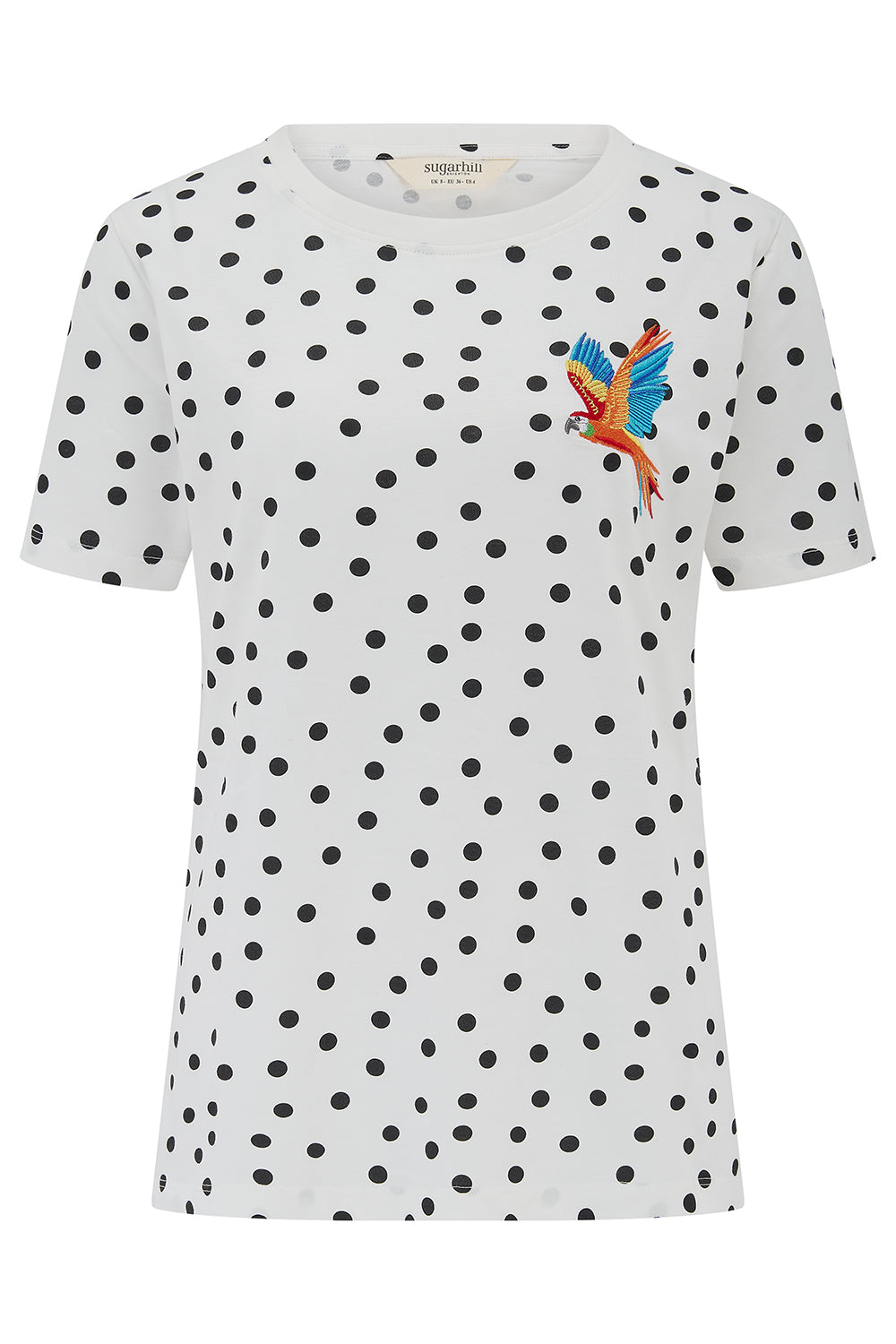 White t-shirt with black polka dot pattern and colorful parrot design on a white background