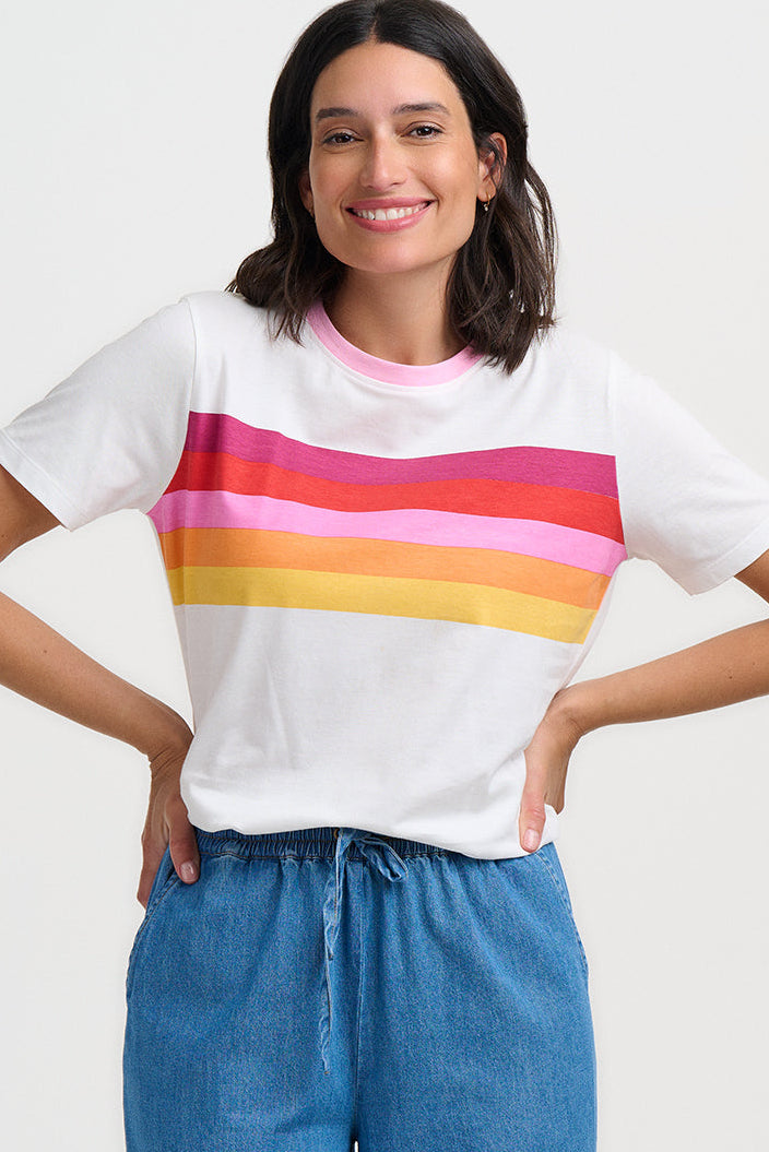 Person wearing a white t-shirt and blue jeans on a white background