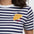 Navy and white striped shirt with a croissant design on a plain background