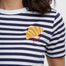 Navy and white striped shirt with a croissant design on a plain background