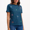 Woman wearing a blue and black striped t-shirt with embroidered designs on a white background