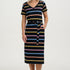 Woman wearing a black dress with colorful stripes on a white background