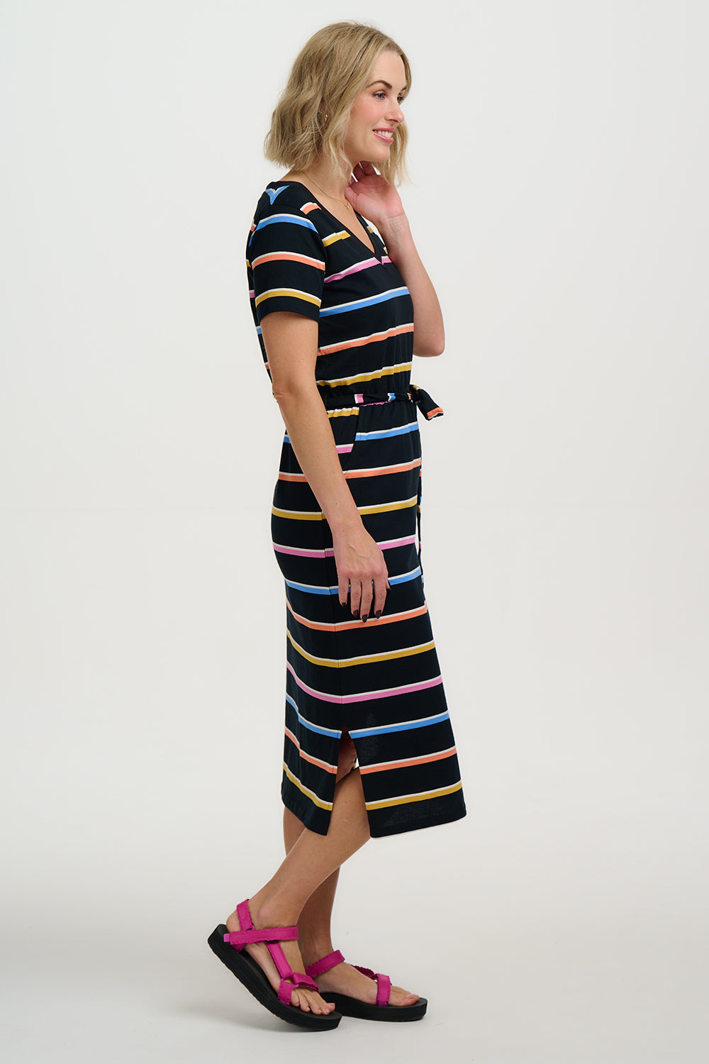 Woman wearing a black striped dress on a white background