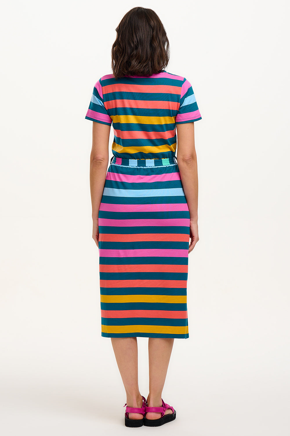 A model wearing a midi-length V-neck dress with stripes in green and other colors, featuring a matching tie belt.