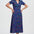Woman wearing a colorful dress with a white background