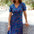 Woman wearing a colorful dress with a white background