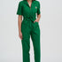 Woman wearing a green jumpsuit on a white background