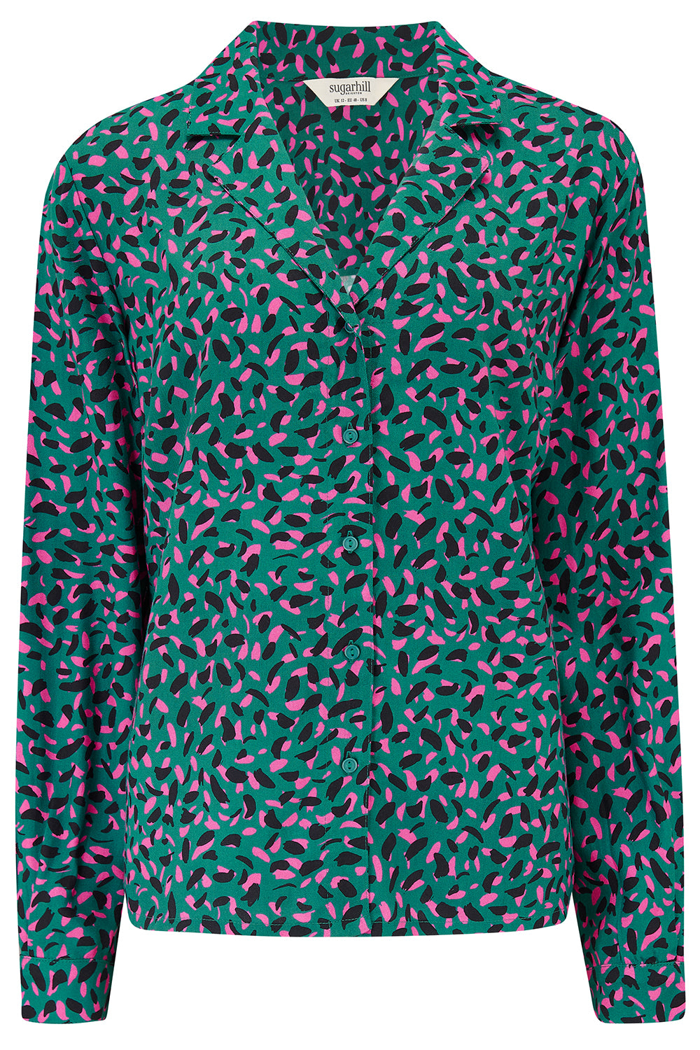 Green blouse with pink abstract pattern on a white background