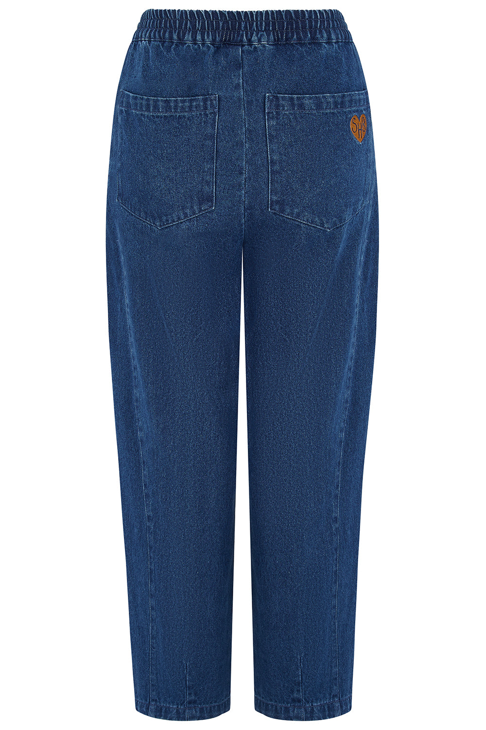 Back view of a pair of blue denim cropped pants with an elastic waistband, two back pockets, and a small brown heart patch on the right pocket, shown on a white background.