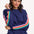 A navy sweatshirt with rainbow trim on the sleeves, displayed on a model against a white background.