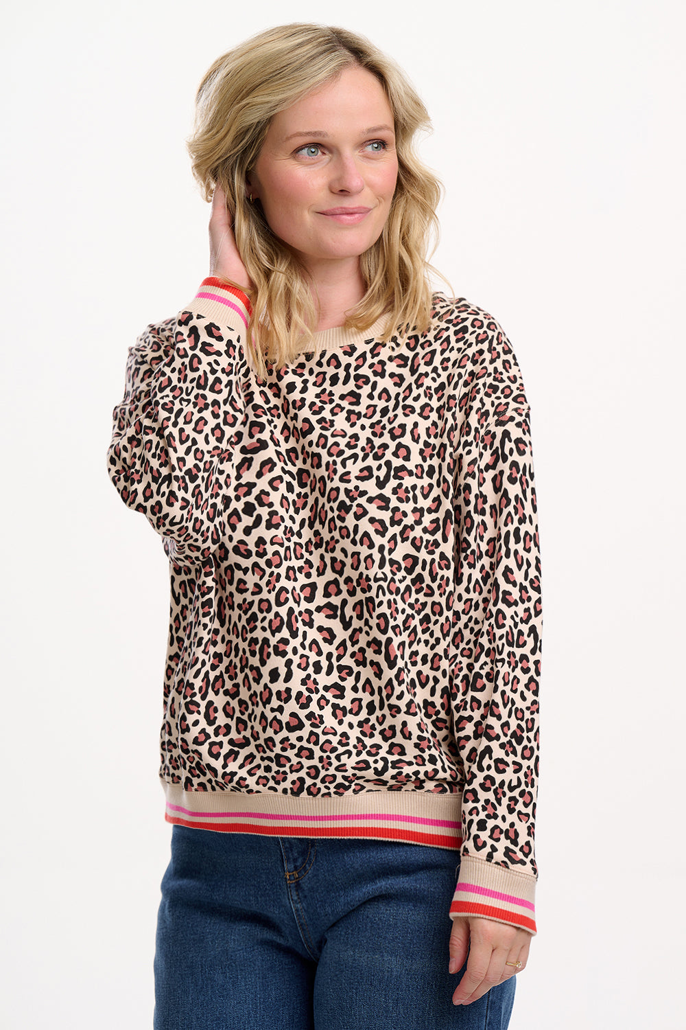 Leopard print sweatshirt with pink and red trim on a white background
