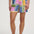 Person wearing colorful patterned shorts on a white background