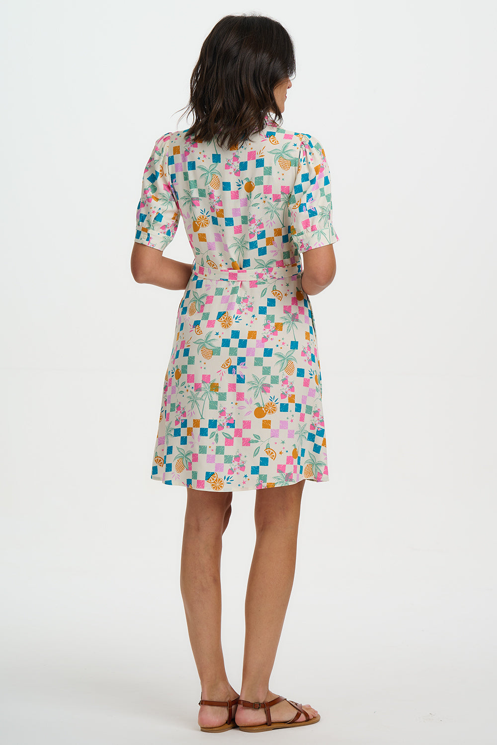 Woman wearing a floral dress on a white background
