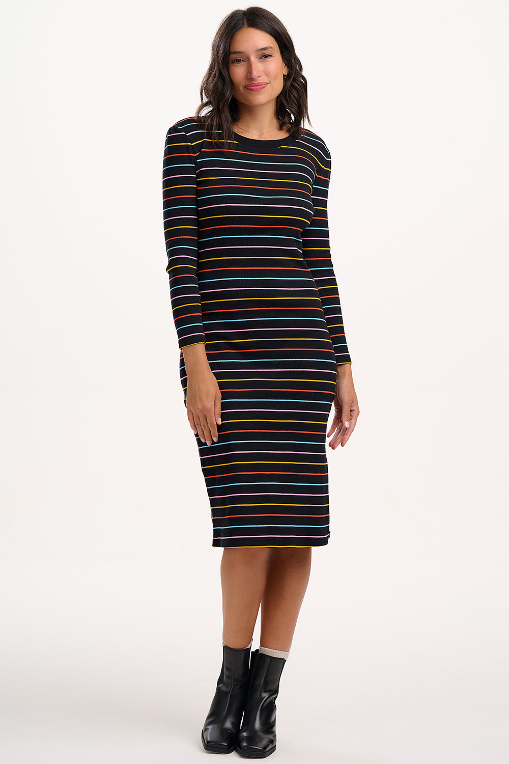 Woman wearing a striped dress on a white background