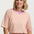 Woman wearing a striped shirt with a plain background